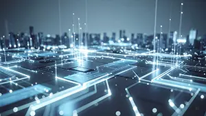 Smart city image where light lines on electronic circuit board look like futuristic buildings