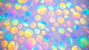Collection of circular bubbles glowing in rainbow colors like oil on water