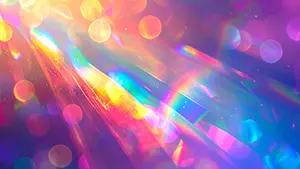 プリズムを通したような虹色の光の筋とキラキラしたボケが輝く幻想的な抽象背景