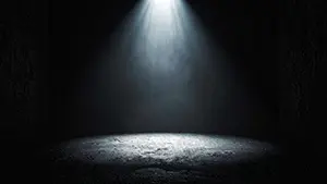 Simple and mysterious background illustration where a white spotlight illuminates the center of a dark concrete room