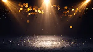 複数の暖かい色のスポットライトが光の粉と共にステージの床を照らしている様子