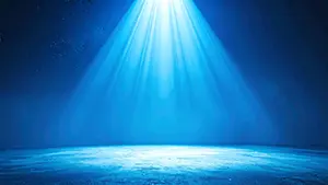 暗い空間の上空から純粋な青い光の筋が放射状に降り注ぎ床を照らしているシンプルな風景
