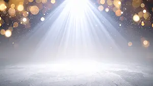 白い放射状の光とゴールドの玉ボケがキラキラと輝く明るくエレガントなステージ空間